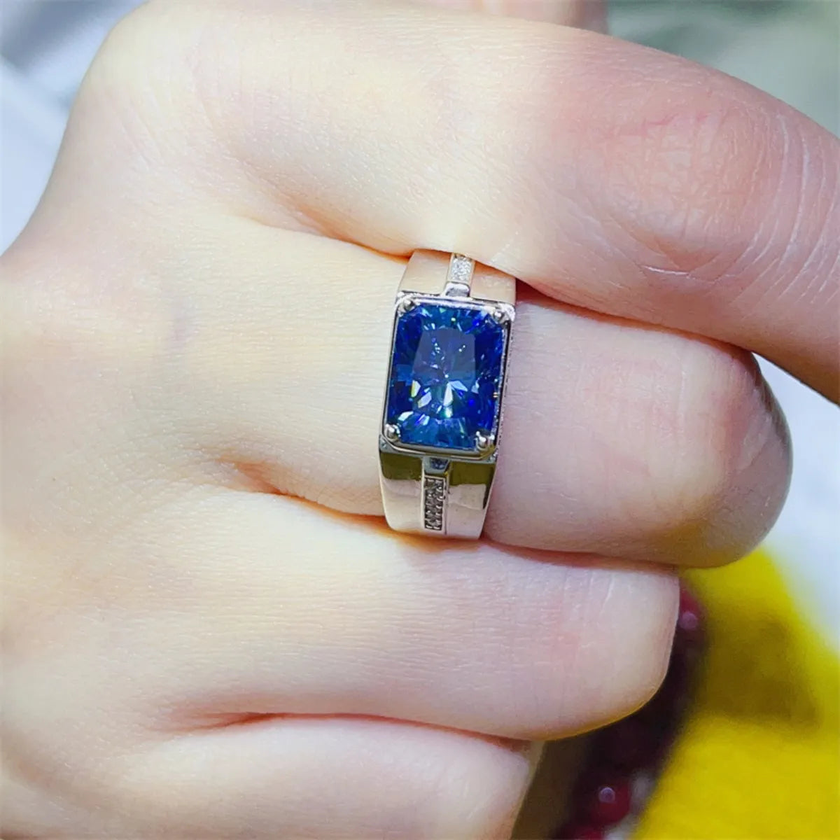 bold blue moissanite ring with rectangular cut and silver band