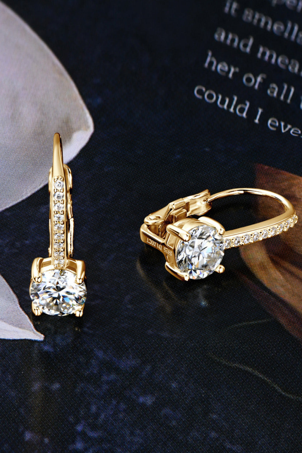 Side view of secure leverback closure on silver moissanite dangle earrings