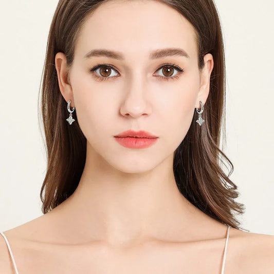 Sparkling four-petal moissanite floral drop earrings in gold plated silver